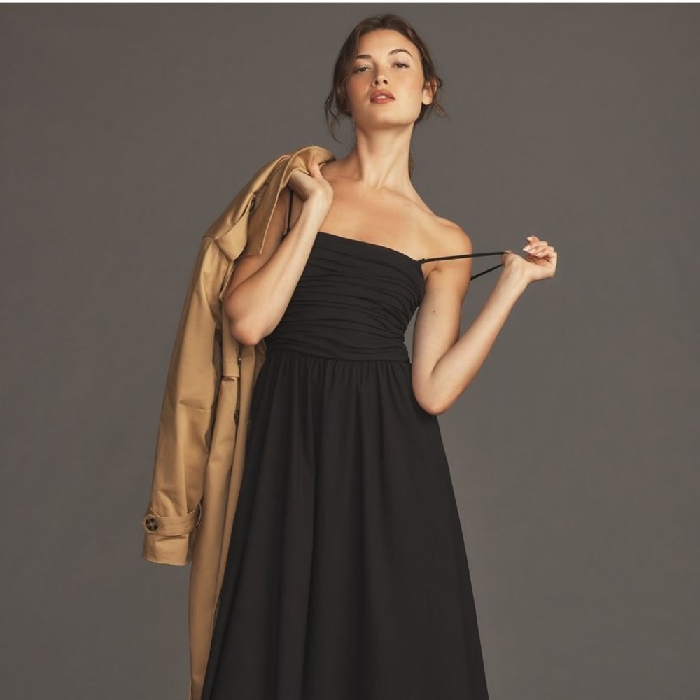 Reformation A-line With fitted ruched bodice and relaxed skirt, midi silhouette